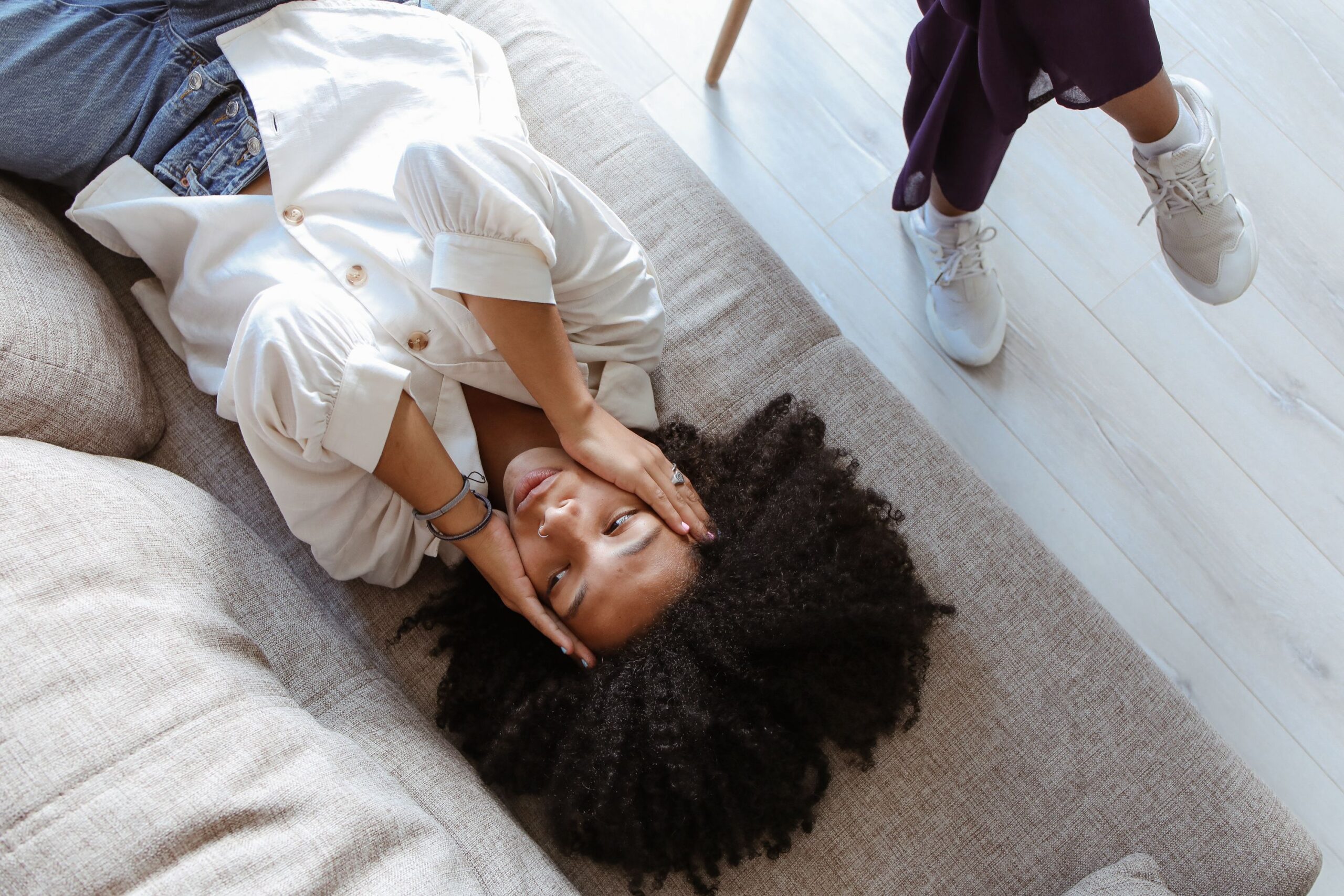 Woman receiving holistic trauma therapy for emotional healing and stress relief
