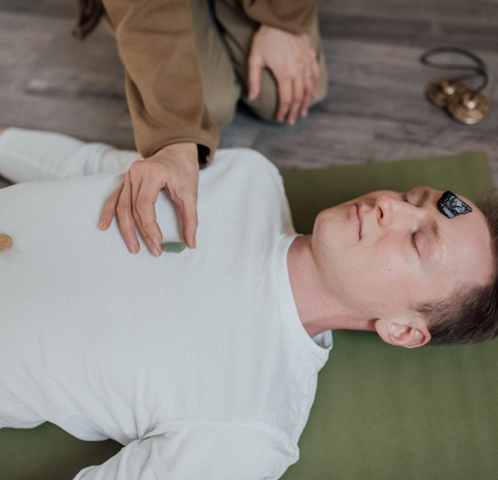 Holistic practitioner providing stress relief and wellness therapy session