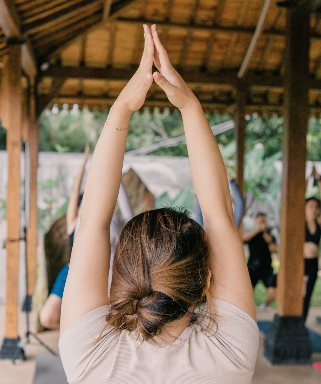 Woman practicing yoga for stress management and holistic health