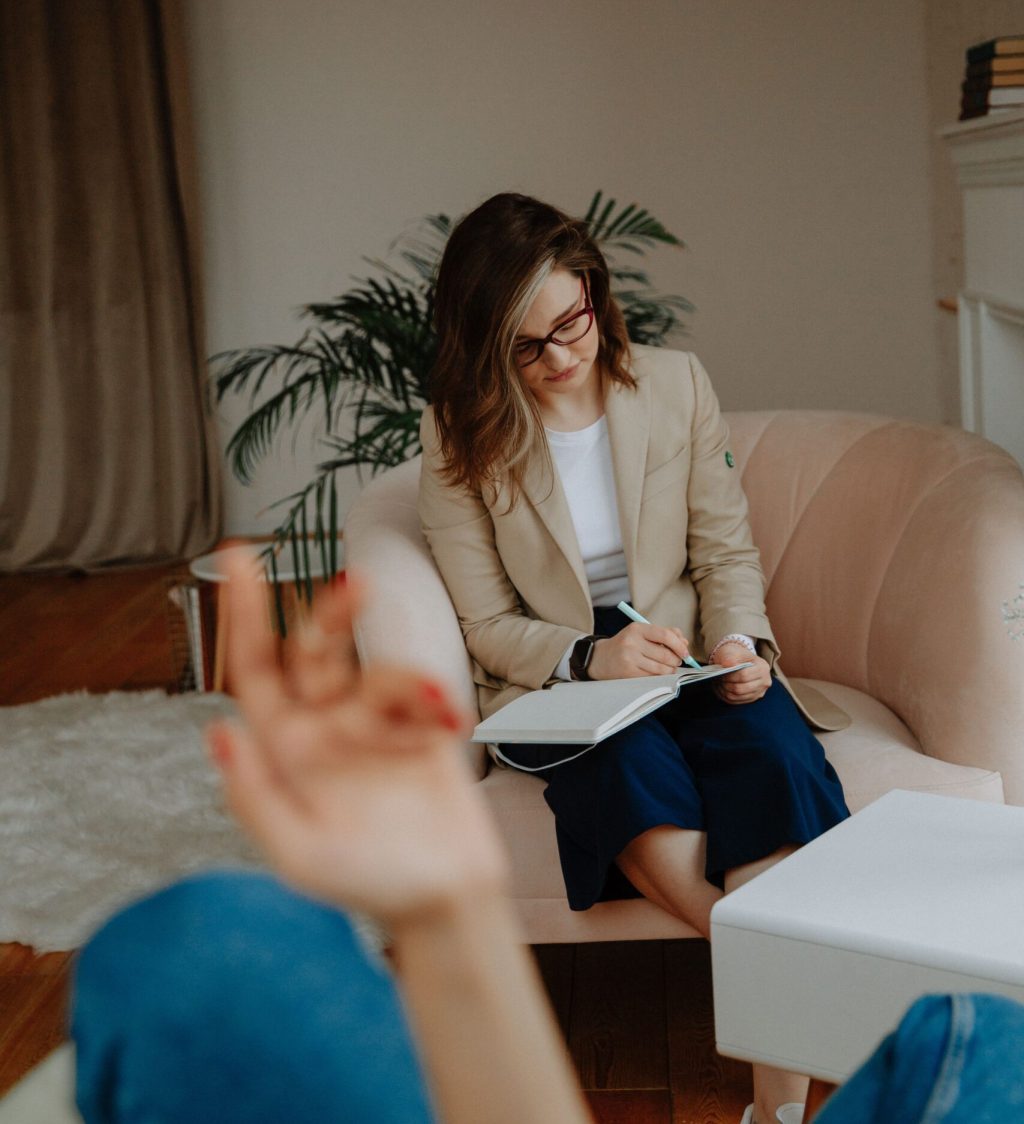 Wellness coach providing personalized mental health and lifestyle support during consultation
